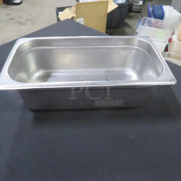 1/3 Size 4 Inch Deep Hotel Pan, stainless steel, excellent condition; suitable for catering and food service use.