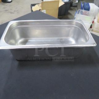 Stainless steel 1/3 size 4-inch deep hotel pan, used condition, ideal for food service or catering needs.