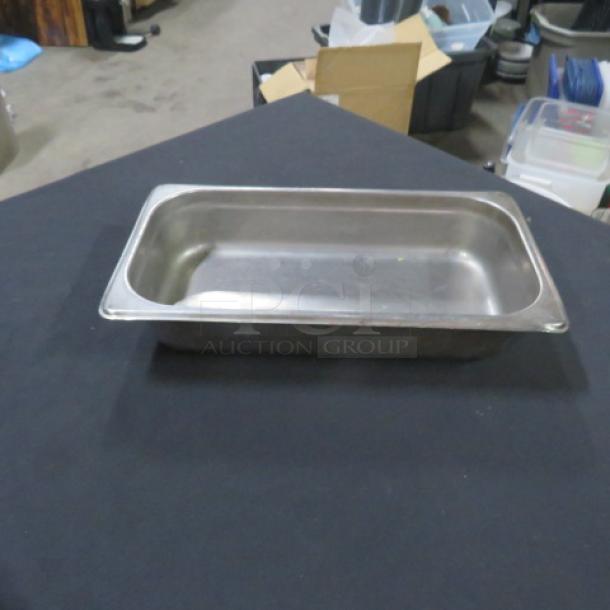 1/3 size stainless steel hotel pan, 2.5-inch deep, good condition, ideal for food service or catering use.
