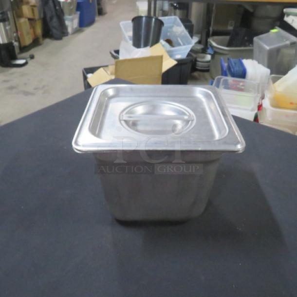 1/6 Size 6 Inch Deep Hotel Pan with Lid, stainless steel, excellent condition, ideal for food service and catering.