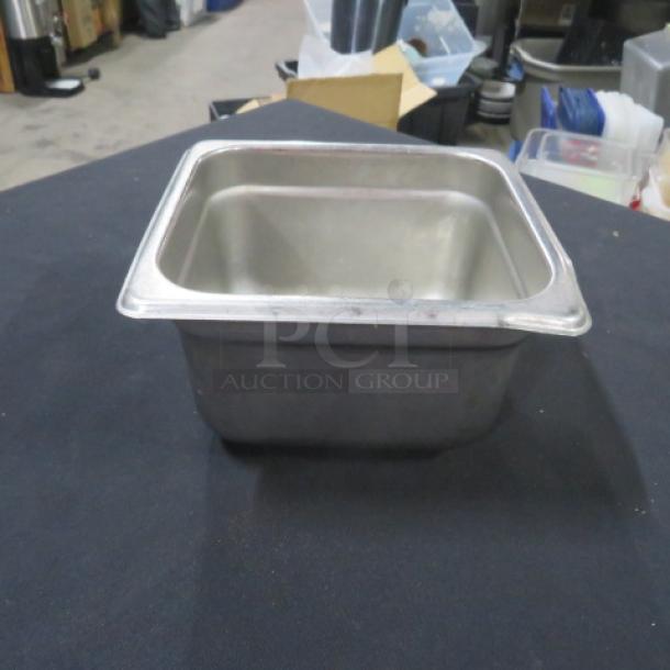 1/6 size 4-inch deep hotel pan, stainless steel, used, minor wear. Ideal for foodservice applications. Marked as 3XBID.