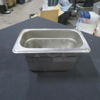 1/9 size, 4-inch deep stainless steel hotel pan in good condition. Ideal for catering and food service.