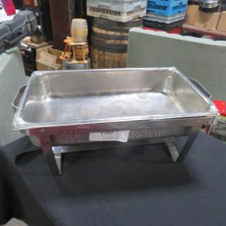 Stainless steel full-size chafer without lid, rectangular shape, reinforced handles, sturdy legs, mild wear, marked "150."