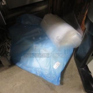 Assorted vac bags, varying sizes, unused, includes clear and blue bags, visible tag indicates assorted lot.