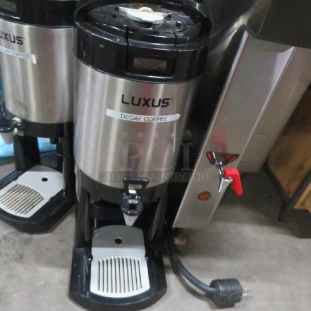 Fetco Luxus 1.5 Gallon Coffee Server L4D-15 with stand, decaf label visible, stainless steel, gently used condition.