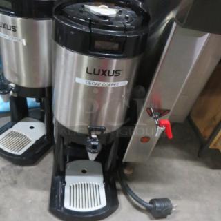 Fetco Luxus 1.5 Gallon Coffee Server L4D-15 with stand, decaf label visible, stainless steel, gently used condition.