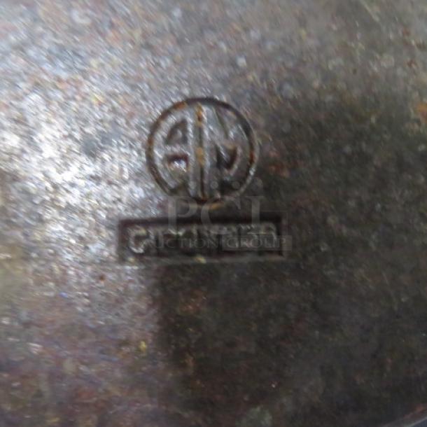 American Metalcraft 27oz pre-seasoned cast iron baking dish with handles. Features logo and model marking CPO1856.