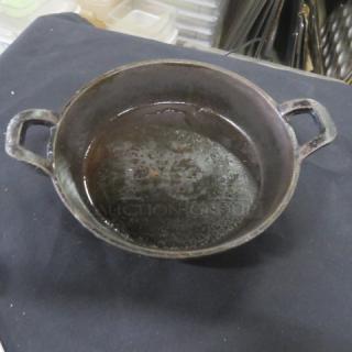 Valor cast iron pre-seasoned 6.5-inch round baking dish with handles. Used condition, model 12XBID.