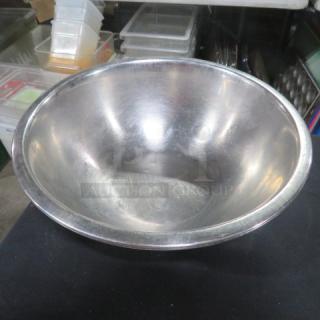 10.5-inch stainless steel mixing bowl, slightly used condition, reflective surface, ideal for kitchen use.