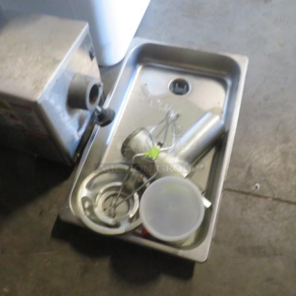Pro Cut KG-12-FS meat grinder in used condition. Includes detachable parts on tray. Operates at 115 volts.