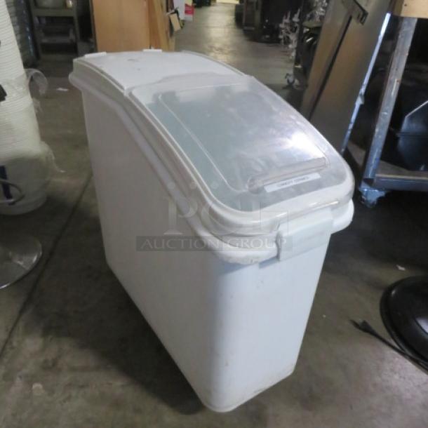 White ingredient bin on casters with hinged lid, used condition; ideal for storing bulk ingredients.