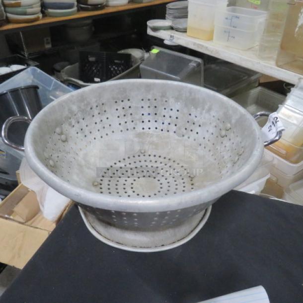 16.5-inch aluminum colander with dual handles, perforated for drainage, in used condition, ideal for kitchen use.