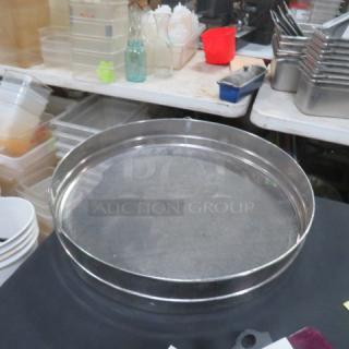 18-inch stainless steel sifter, mesh design, good condition. Ideal for baking, durable material. No visible markings.