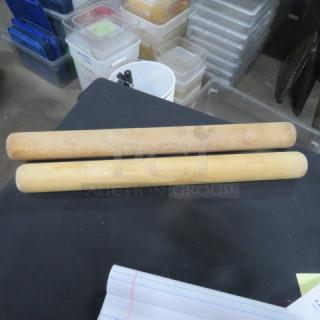 Two wooden rolling pins in good condition, smooth surface.
