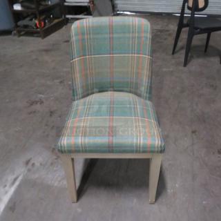 Pottery Barn dining chair with green plaid cushioned seat, wooden legs. Excellent condition, suitable for dining room.