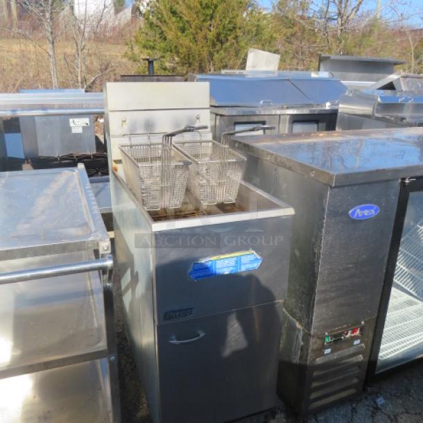 Pitco Natural Gas Deep Fryer, Model 35C+, with two baskets on casters. Measures 15"x30"x46".