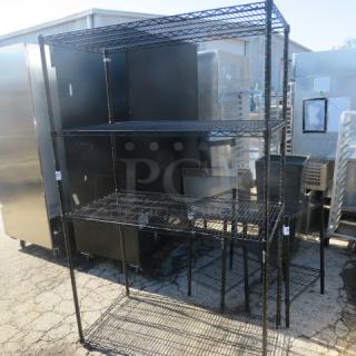 Black Metro shelf unit with 4 wire shelves, 48x24x75 inches, sturdy metal construction, suitable for storage.