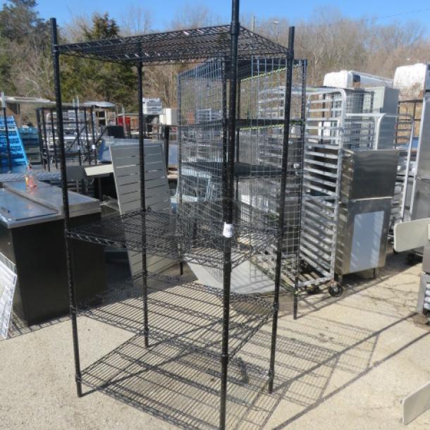 Black Metro shelf unit with 4 wire shelves, dimensions 36x24x75, in good condition. Ideal for storage or display.