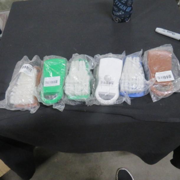 New Cutting Board Brushes, model PLCBB02BR, in various colors, sealed in packaging. Appears in brand new condition.