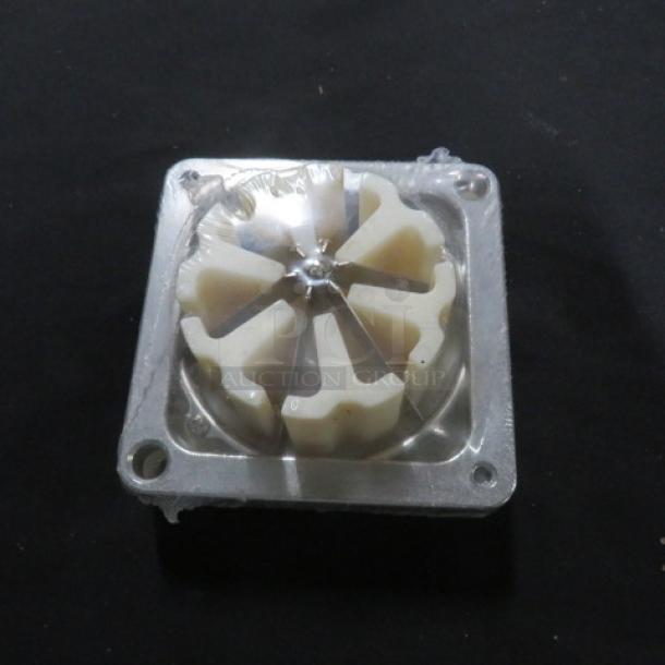 New vegetable cutter blade in packaging, square metal frame, six-section design.