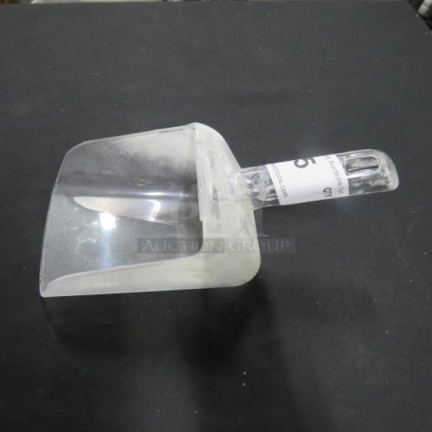 Transparent poly scoop with ergonomic handle, slightly used condition. Auction tag attached.