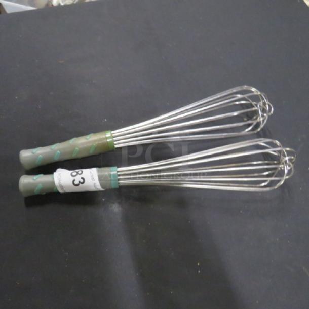 Two commercial whisks with gray and green handles, labeled "83," in excellent condition, ideal for professional kitchens.