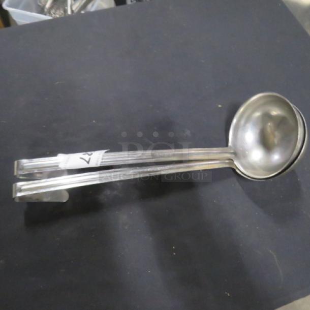 12oz stainless steel ladle, model 2XBID. Features a long handle and deep bowl. Label indicating item number 27. Slightly used.
