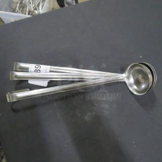 4oz stainless steel ladle, 3XBID, excellent condition, long handle. Auction label visible, number 189. Ideal for serving.