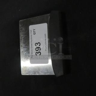 Stainless steel dough cutter with black handle, in good condition. Auction label reads "393" with auction site details.