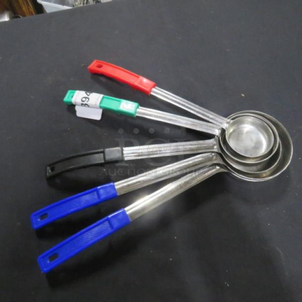 Set of assorted size spoodles with colored handles. Each spoodle features a stainless steel body. Good condition.