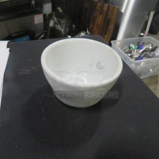 Tuxton white ceramic salsa bowl, model 11XBID, in good condition. Simple design with slightly flared rim.