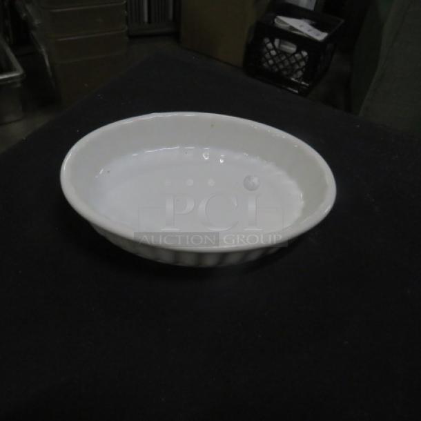 Acopa Oval Souffle Dish, 5.5x4 inches, white ceramic, in good condition, ribbed outer surface.