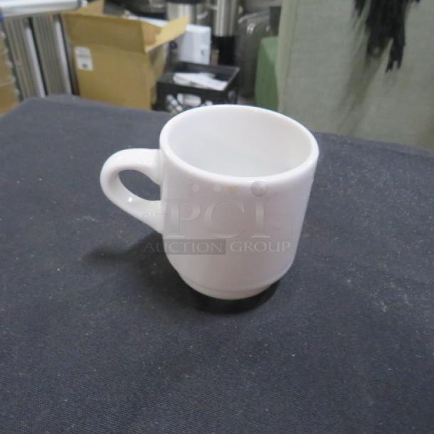 White ceramic espresso cup with handle, model 12XBID, in excellent condition, no visible markings or tags.
