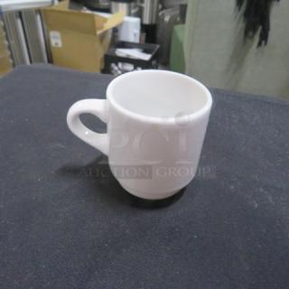 White ceramic espresso cup with handle, model 12XBID, in excellent condition, no visible markings or tags.