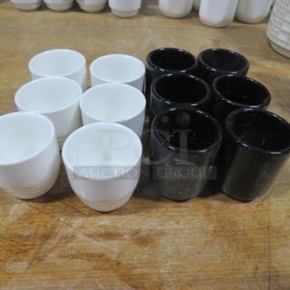 Assorted sake cups, 12-piece set, white and black ceramic. Clean condition, ideal for collectors or beverage enthusiasts.