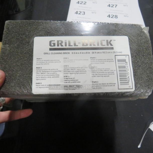 NEW Grill Brick, 8XBID model. Measures 3.5x4x8 inches. Label shows cleaning instructions and bar code. Unused condition.