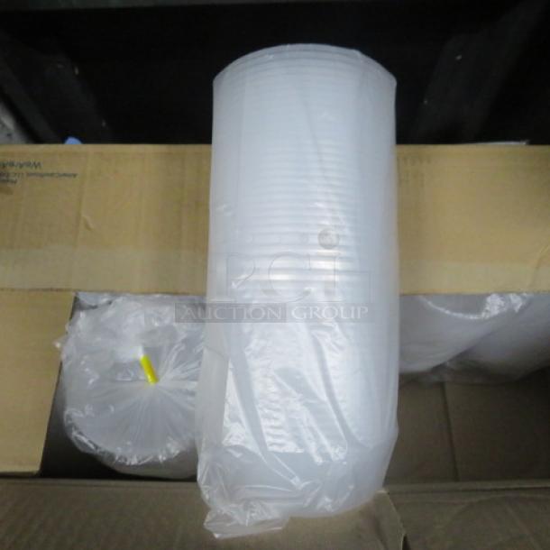 One lot of 8oz transparent deli containers, new in packaging, wrapped in clear plastic, showcasing cylindrical shape.