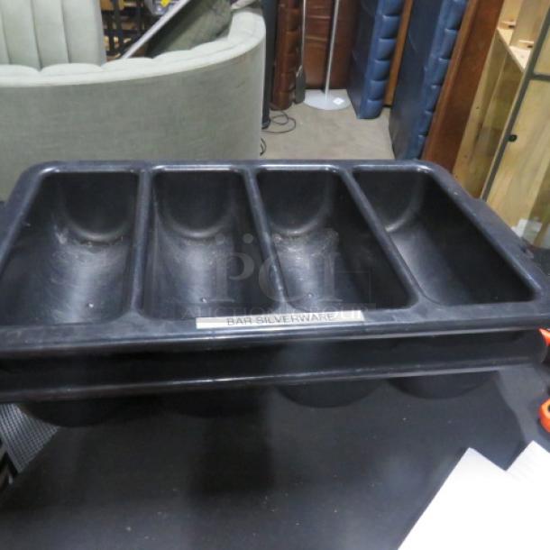Black flatware holder with four compartments, labeled "Bar Silverware." Used condition, suitable for organizing utensils.