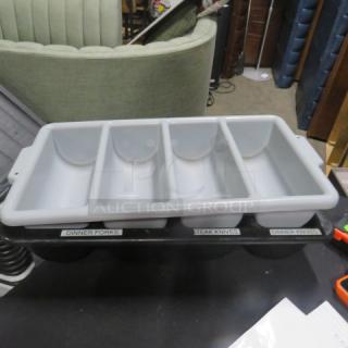 Gray plastic flatware holder with four compartments labeled for dinner forks, steak knives, and dinner knives, in good condition.