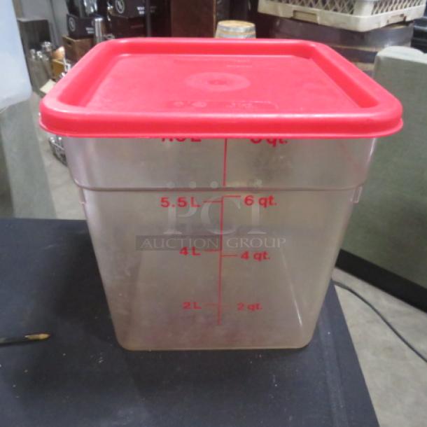 8 quart food storage container with red lid, marked in quarts and liters. Clear plastic, good condition.