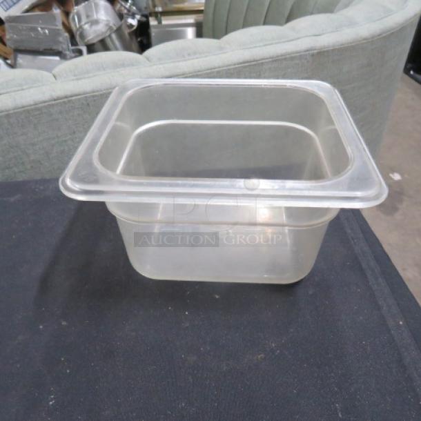 1/6 size 4-inch deep clear food storage container, used. No visible markings or labels. Clean condition.