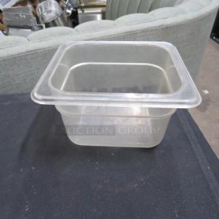 1/6 size 4-inch deep clear food storage container, used. No visible markings or labels. Clean condition.