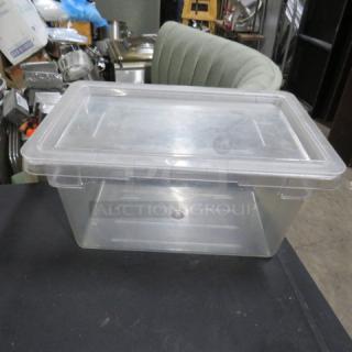 Clear 4.75-gallon food storage container with lid. Durable plastic, rectangular shape, secure fit. Used condition.