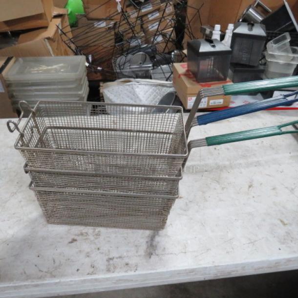 Stacked deep fry baskets with green handles, model 3XBID, in good condition. Made of metal wire mesh.