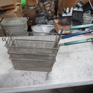 Stacked deep fry baskets with green handles, model 3XBID, in good condition. Made of metal wire mesh.