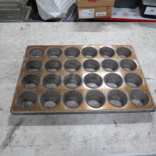 24 hole commercial muffin pan, metal, used condition, slight discoloration, ideal for bakery use, model 2XBID.