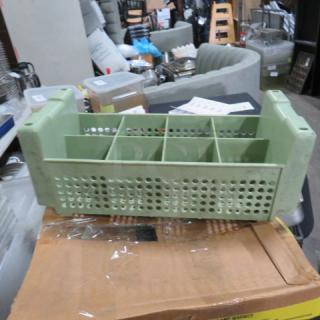 Green flatware dish rack with multiple compartments. Used condition, ideal for organizing kitchen utensils.