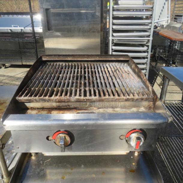 24-inch tabletop natural gas charbroiler, used condition, 24x26x14 inches, visible control knobs, suitable for commercial use.