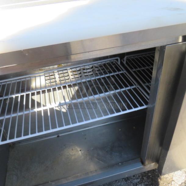 Avantco 2-door refrigerated prep table with cutting board, two stainless steel overshelves, and double warmer. Model 178SSPT60-HC.