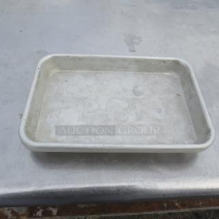 1/4 Size Sheet Pan, used, metal construction. Shows wear and discoloration. Suitable for baking or roasting.